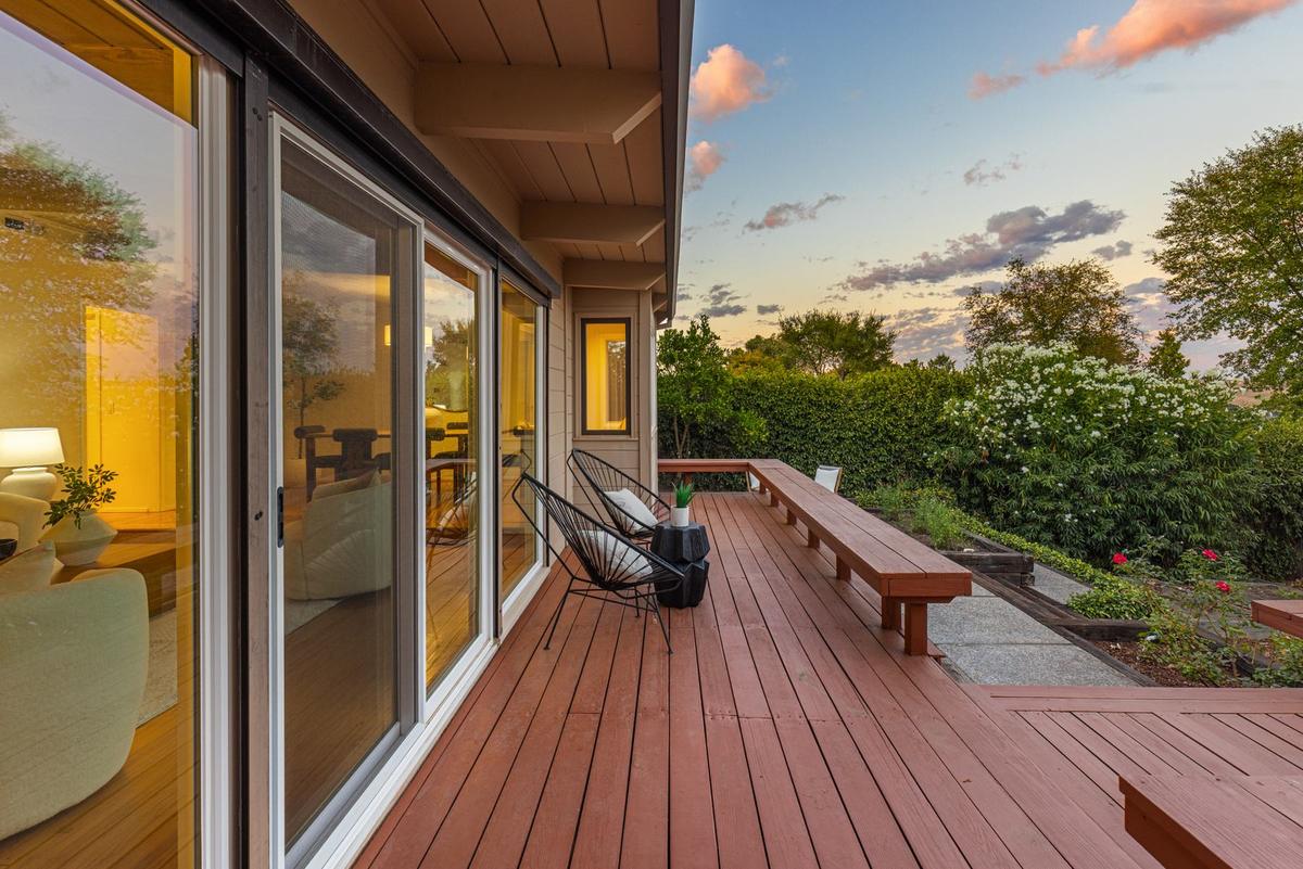 The deck at dusk, running along the living room's sliding doors